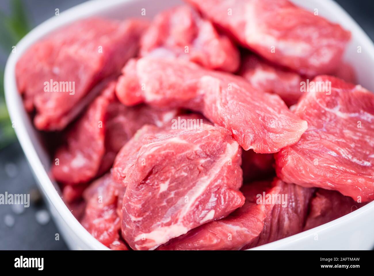 Slate Slab with chopped Beef (close-up shot; selective focus) Stock Photo