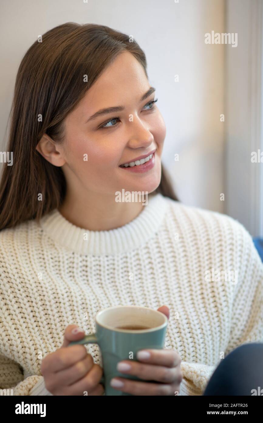 Pleasant pretty woman being in a dreamy mood Stock Photo