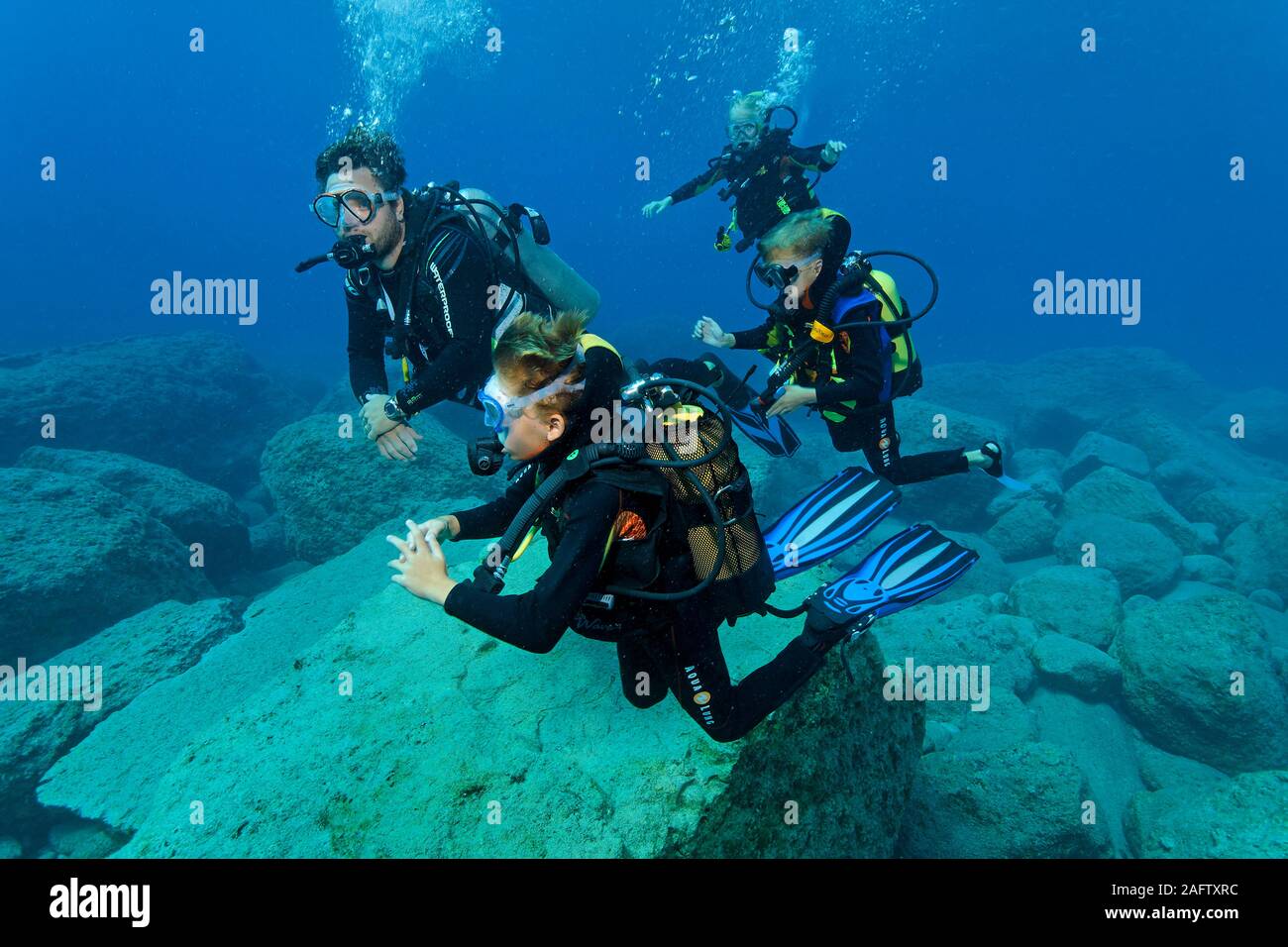Scuba instructor with children, intro diving, Zakynthos island, Greece Stock Photo