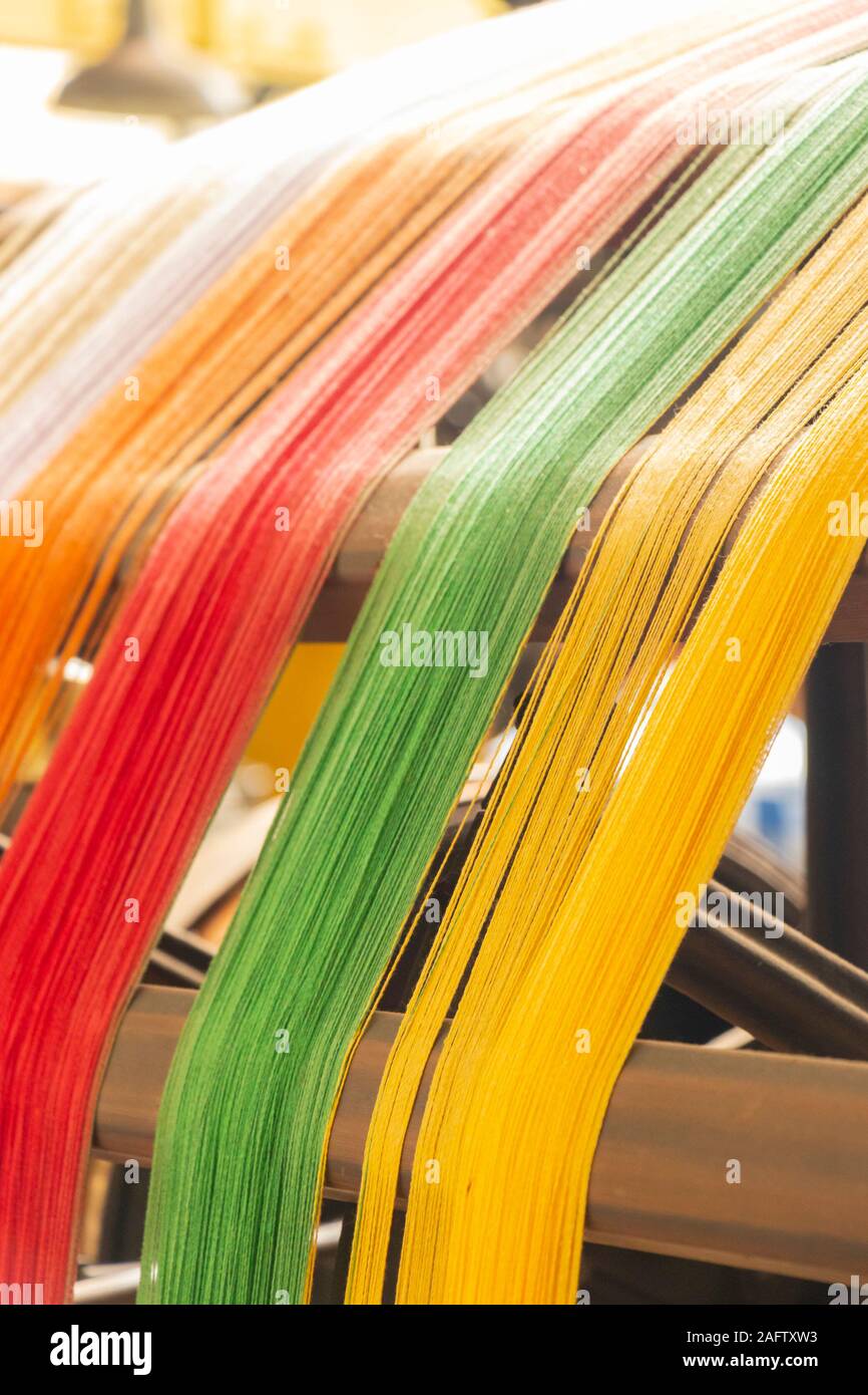 close up detail of colourful cotton yarn on a warping mill in Sir Richard Arkwright's cotton and textile mill at Masson Mills Museum Derbyshire UK Stock Photo