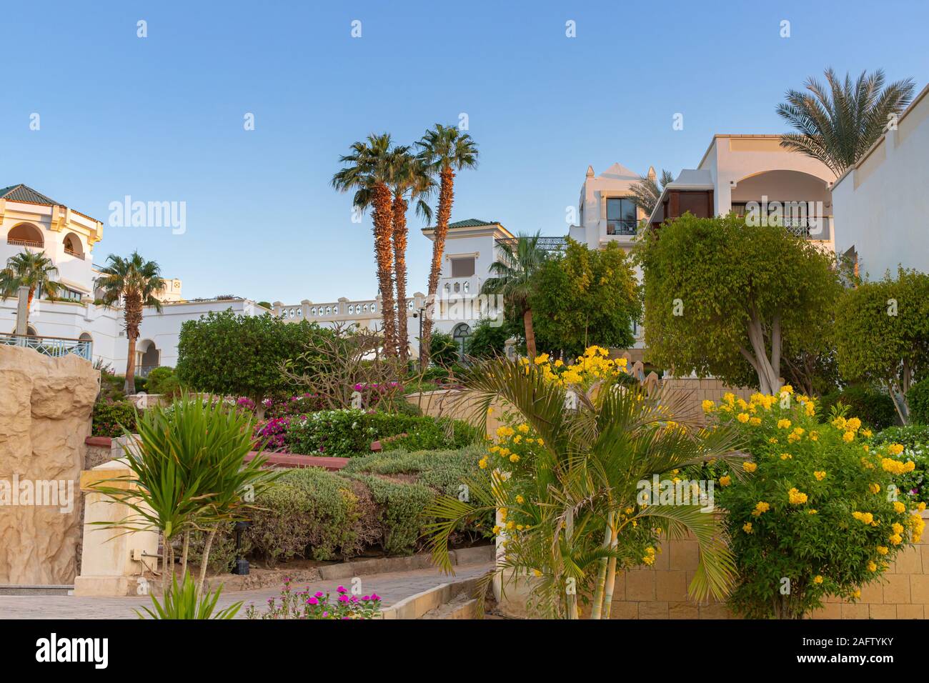 Sharm El Sheikh, Egypt - 11.03.2019: Hyatt Regency Sharm El Sheikh Resort. Exotic greens, resort apartments. Eastern architecture at dawn. Stock Photo