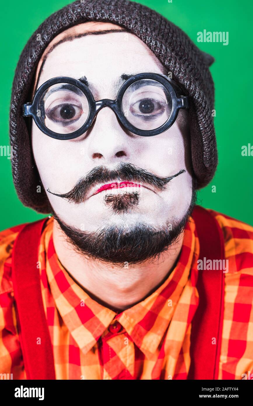 Mime poses and grimaces in the studio Stock Photo