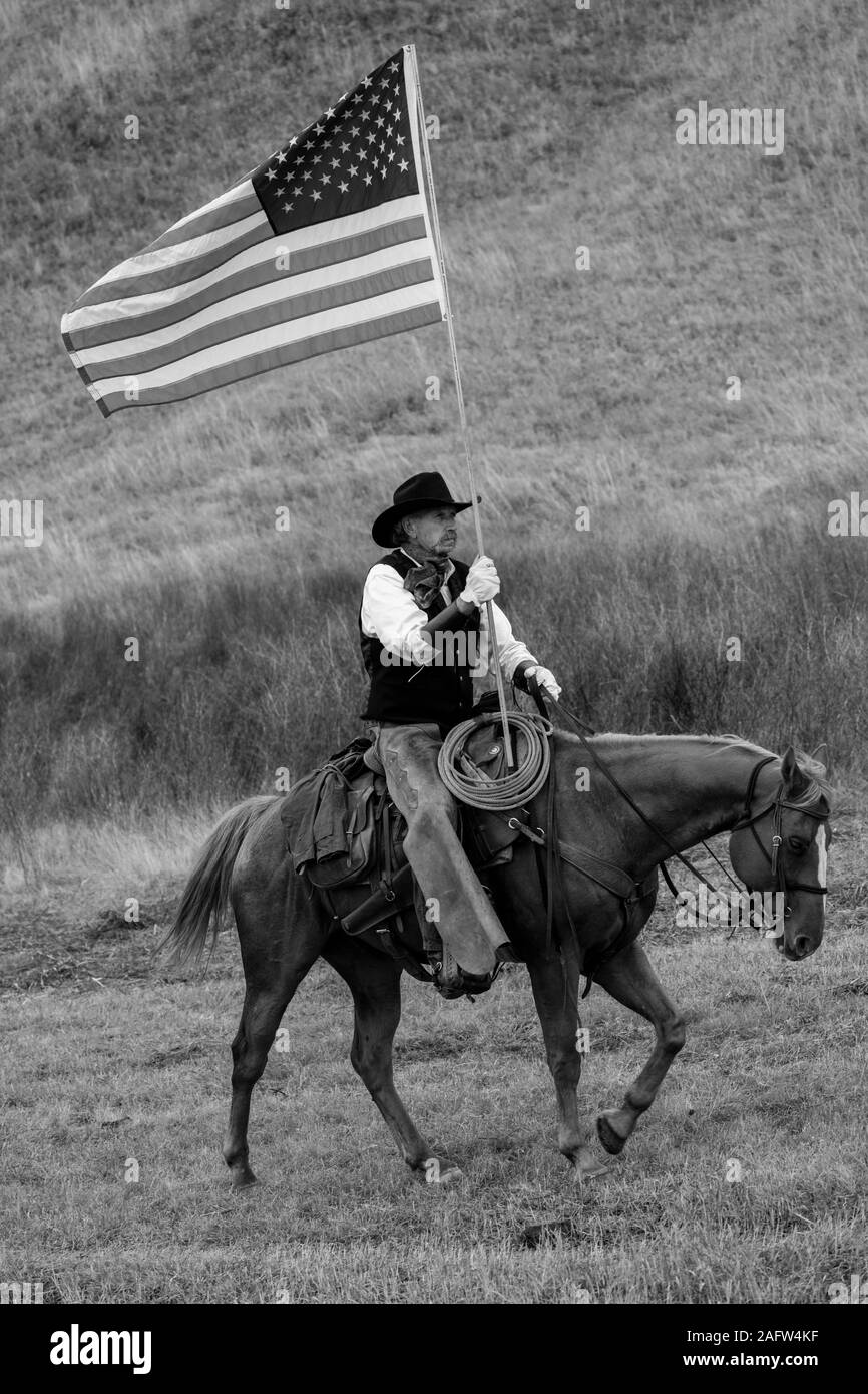 SEPT 27, 2019, CUSTER STATE PARK, SOUTH DAKOTA, USA - Cowboys and Cowgirls carry US Flag at Annual Custer State Park Buffalo Roundup Stock Photo