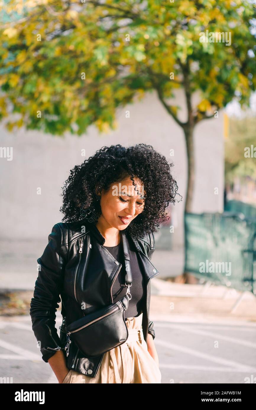 Woman walking in parking lot hi-res stock photography and images - Alamy