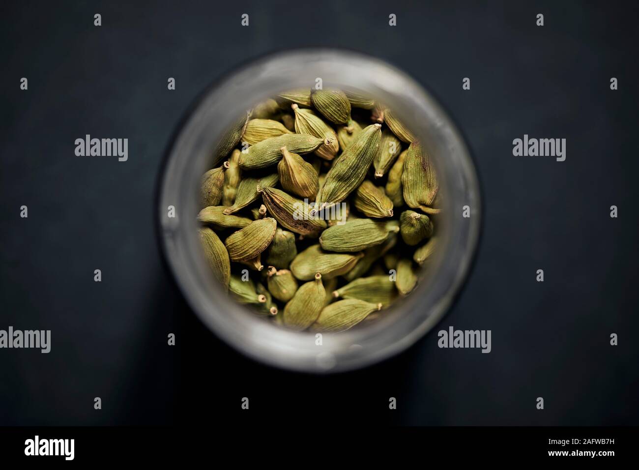 View from above cardamom seeds in spice jar Stock Photo