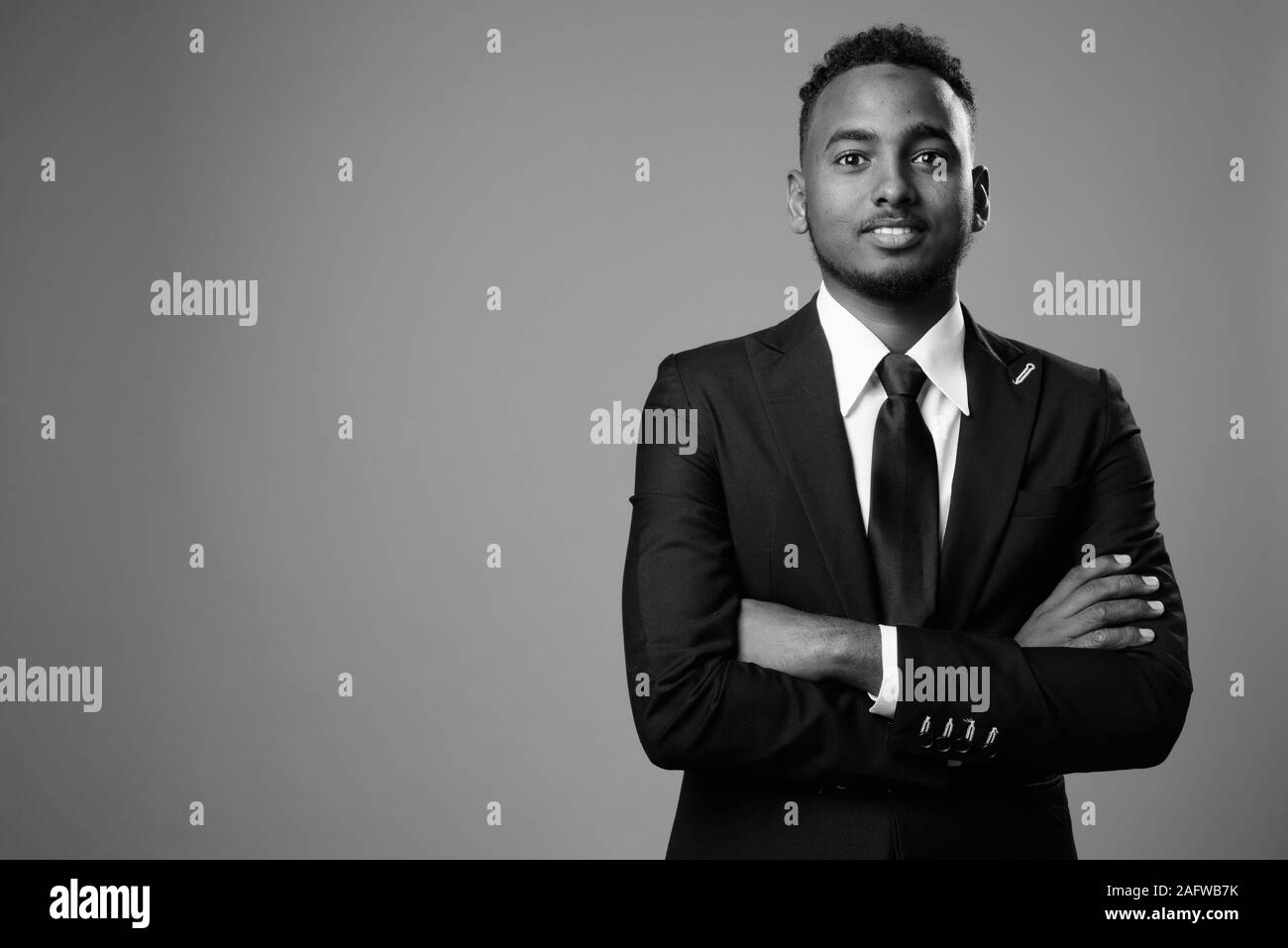 Portrait handsome african guy arms Black and White Stock Photos ...