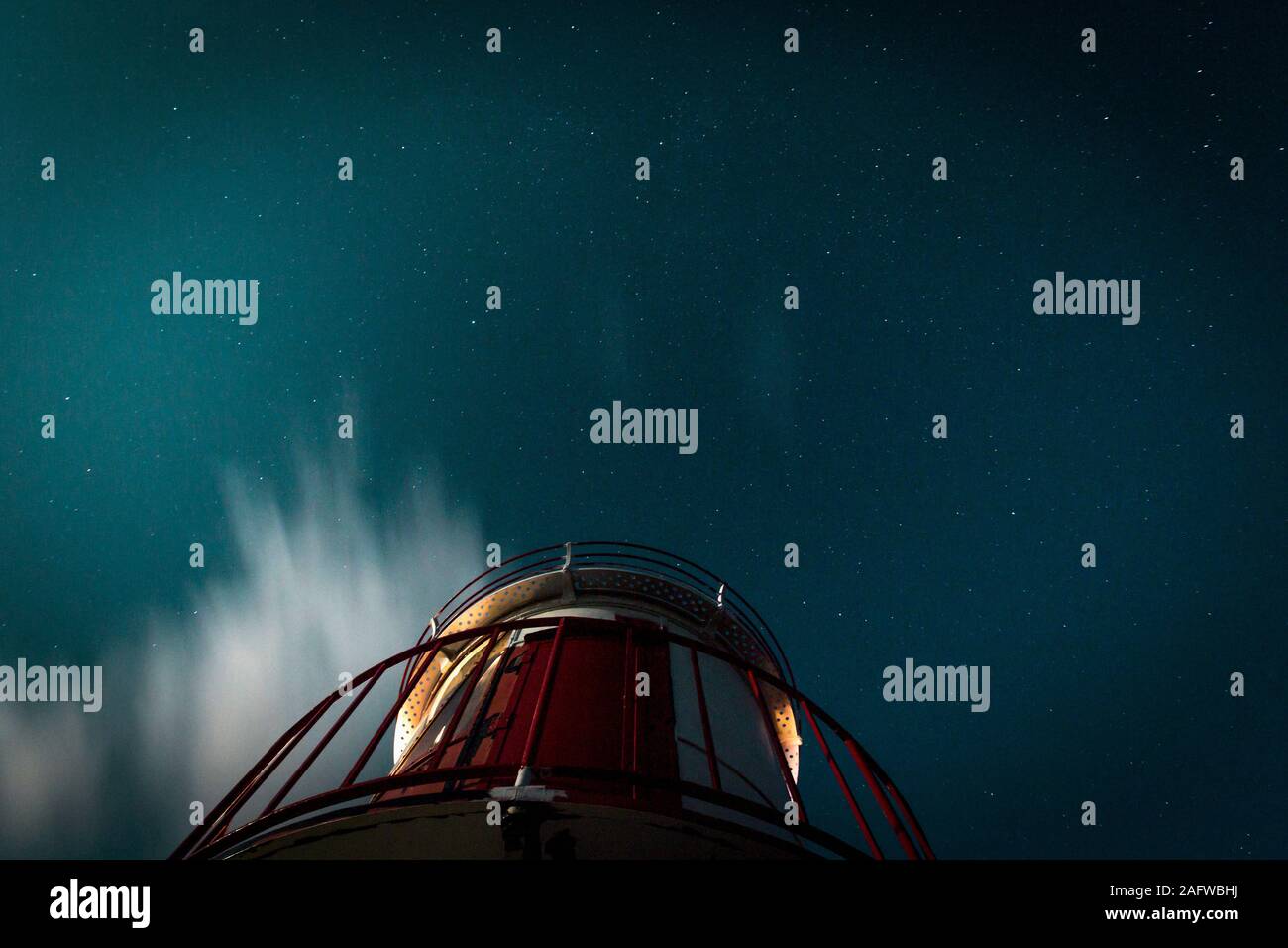 View from below lighthouse under starry night sky Stock Photo - Alamy