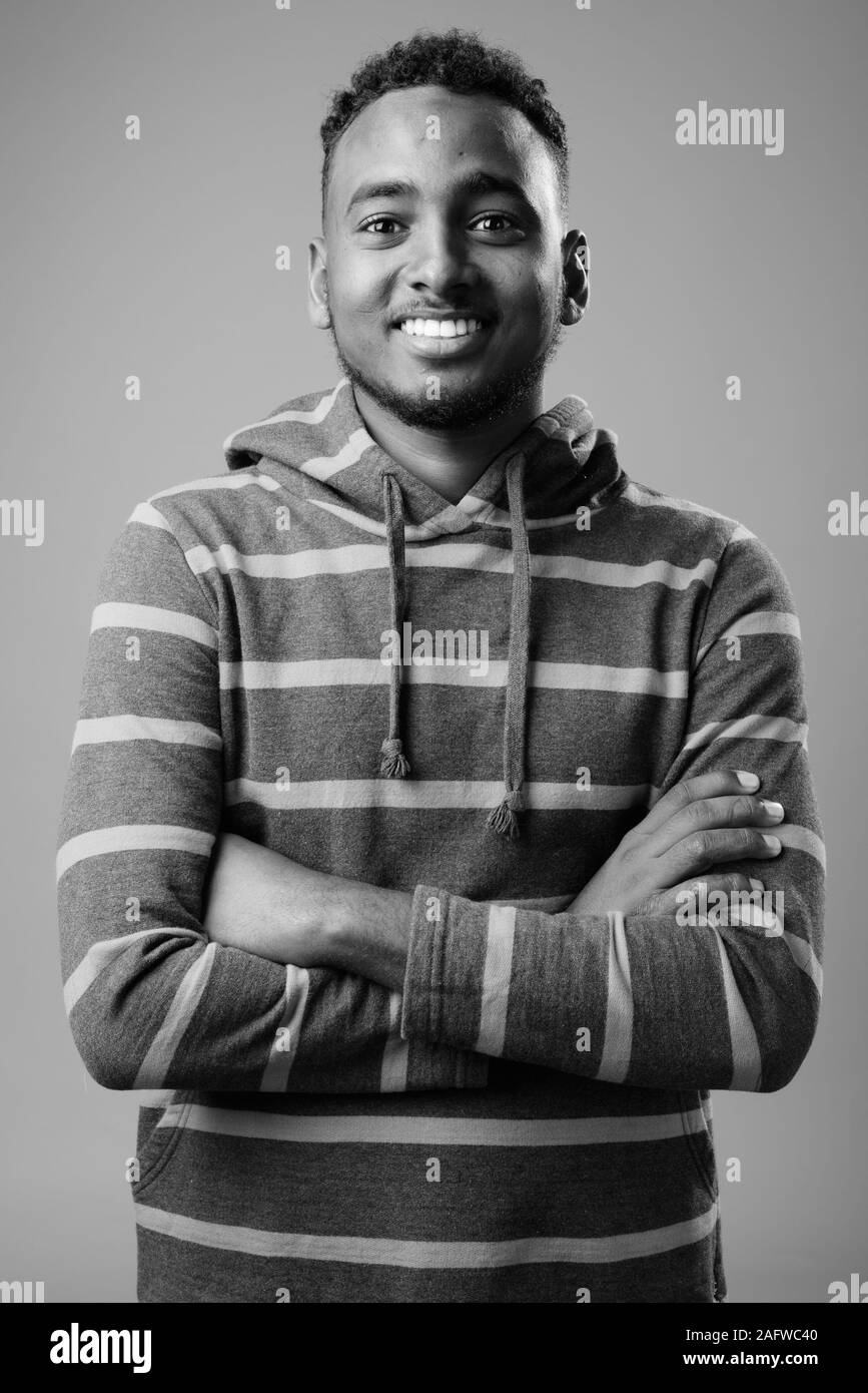 Portrait handsome african guy arms Black and White Stock Photos ...