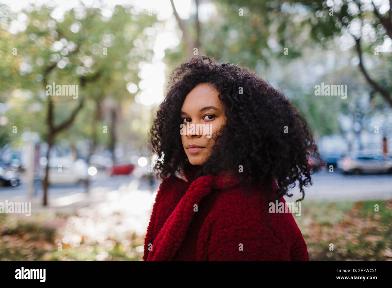 Portrait stylish young woman in autumn park Stock Photo
