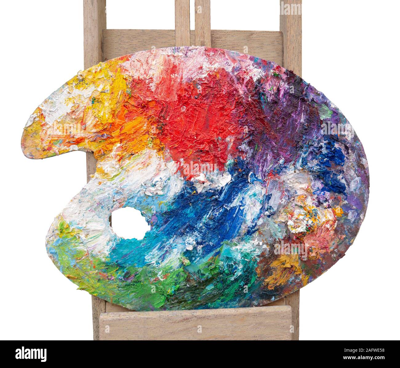 Various oil paints on a colourful wooden painter's pallet Stock Photo