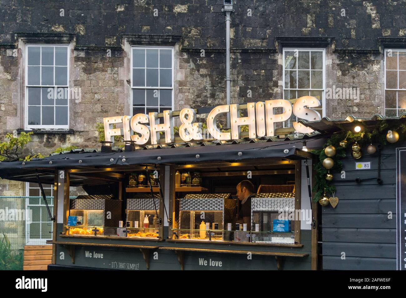 Fish and Chips stall at Winchester Christmas Market next to the Cathedral, Winchester, Hampshire, UK Stock Photo