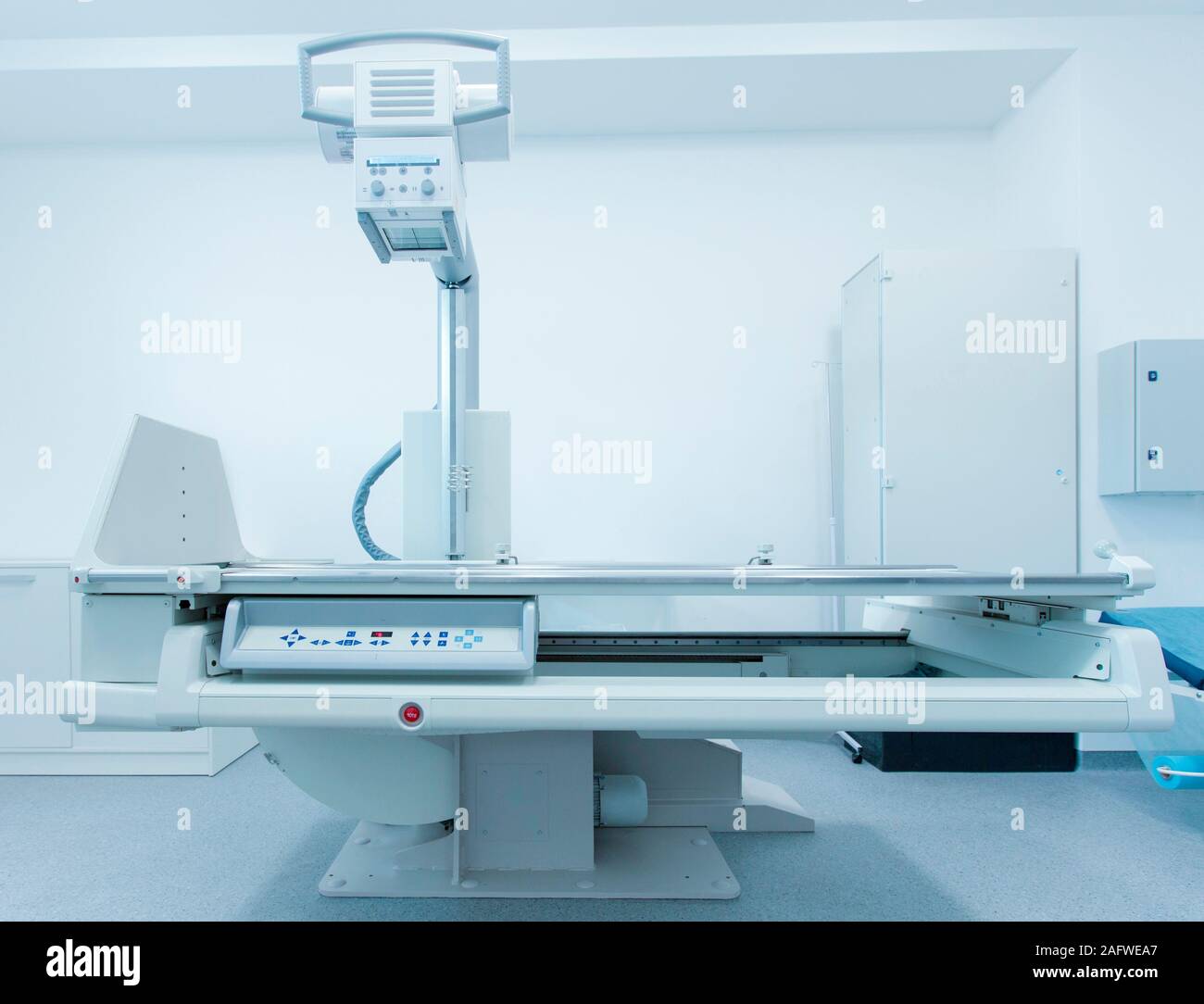 Modern medical room with automatic Xray machine and couch Stock Photo
