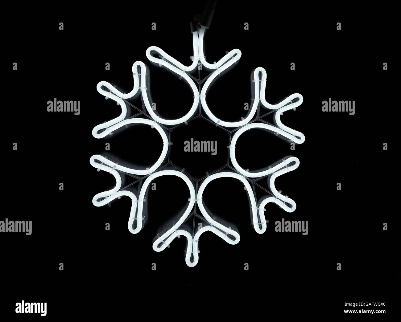 neon effect snowflake christmas decorative light on black background Stock Photo