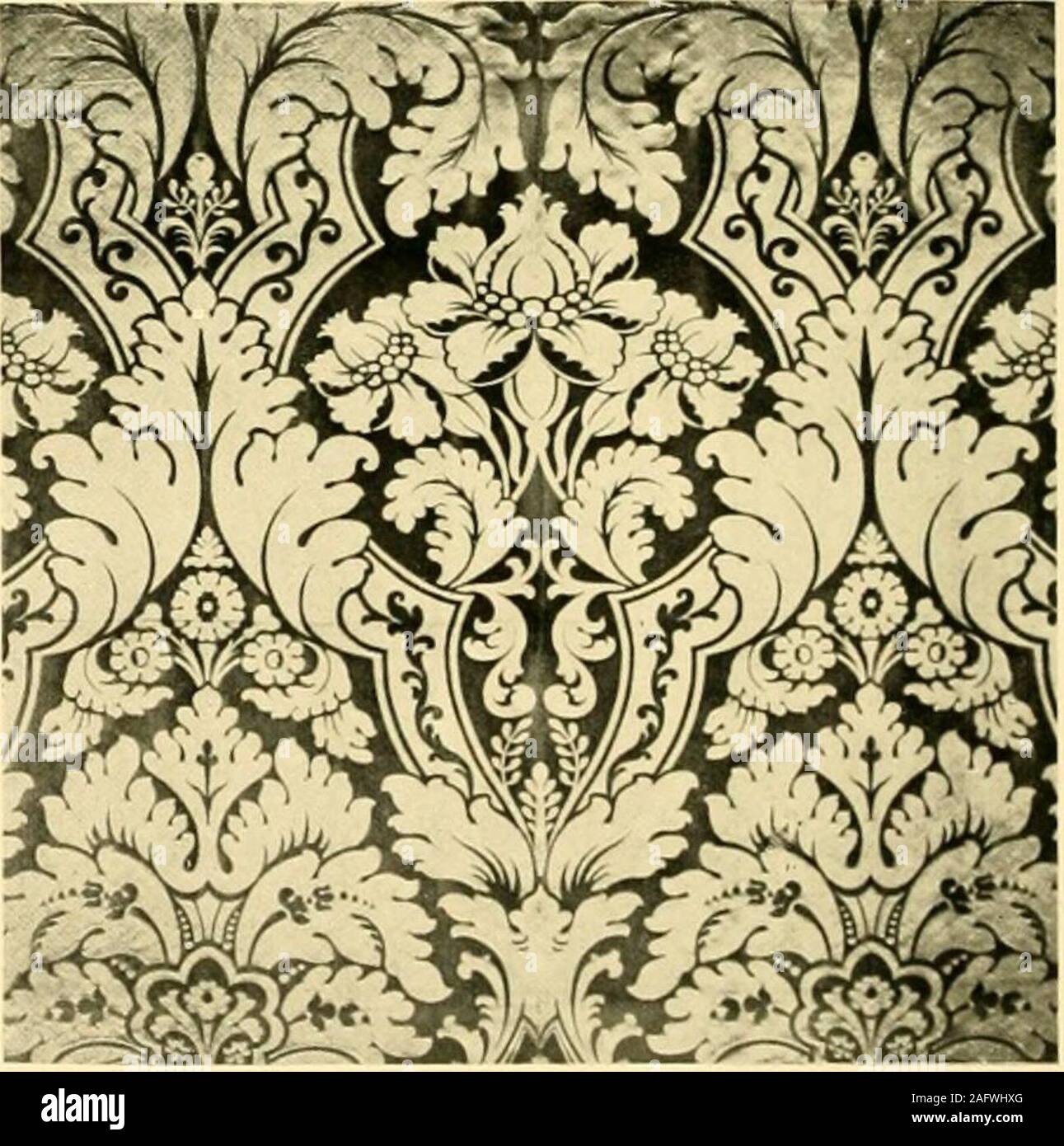 . Decorative textiles; an illustrated book on coverings for furniture, walls and floors, including damasks, brocades and velvets, tapestries, laces, embroideries, chintzes, cretones, drapery and furniture trimmings, wall papers, carpets and rugs, tooled and illuminated leathers. Iliite 1II- AiiicriciiM ri-|)rci(liK-tiii]i cit Friiiili llallli^^k Ilatc IX—C?l?(&gt;^fi;r;liIl il.imask. iiKide in .iiicric-,i 10 DAMASKS. BROCADES AND VELVETS line effects to suggest ribs running the way of the wefts. Plate XX,though sometimes called a silk tapestry, is properly classed withbrocades. It has a Pers Stock Photo
