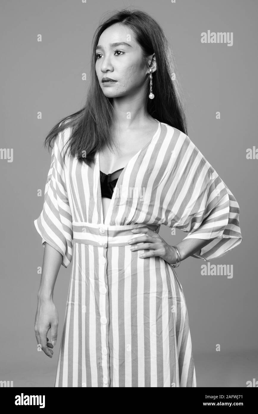 Portrait of young beautiful Asian woman in black and white Stock Photo ...
