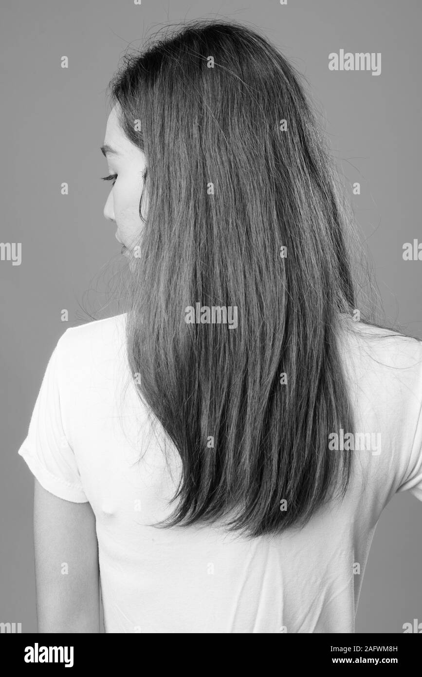 Portrait of young beautiful Asian woman in black and white Stock Photo ...