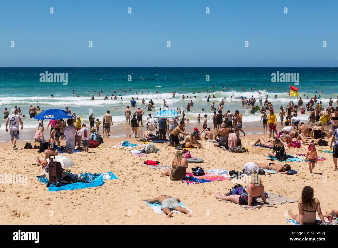 People sunbathing on Manly beach, Sydney, Australia Stock Photo