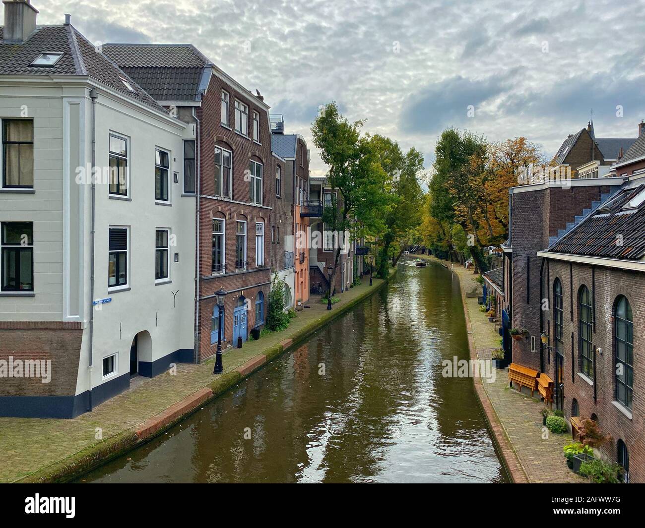 Traditional houses on the Oudegracht (Old Canal) in center of Utrecht. Utrecht is a very old city and the fourth largest city in country. Stock Photo