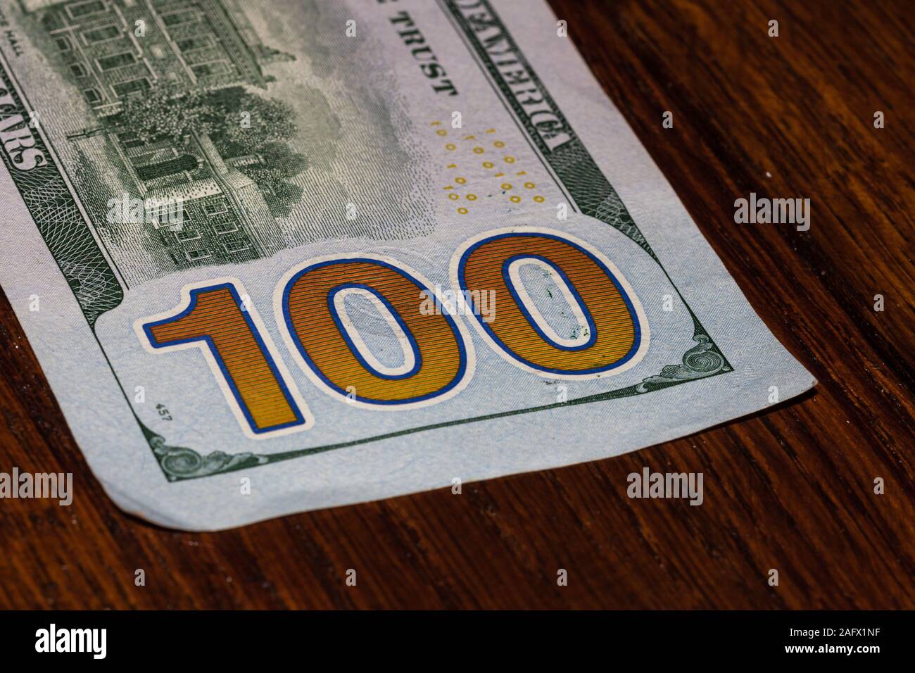Detail on 100 dollars banknote. Close up of banknote laid out on table ...