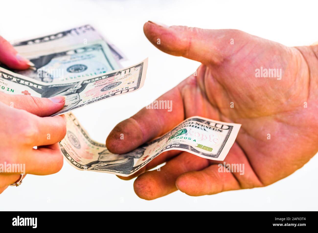 Hand giving money isolated, hard worked hand taking dollars money ...