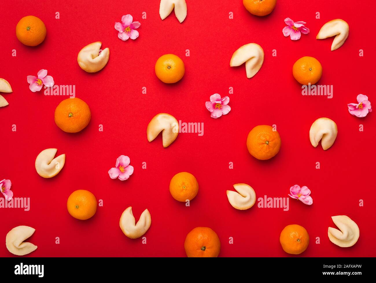 Chinese New Year background of mandarins, sakura petals Stock Photo Alamy