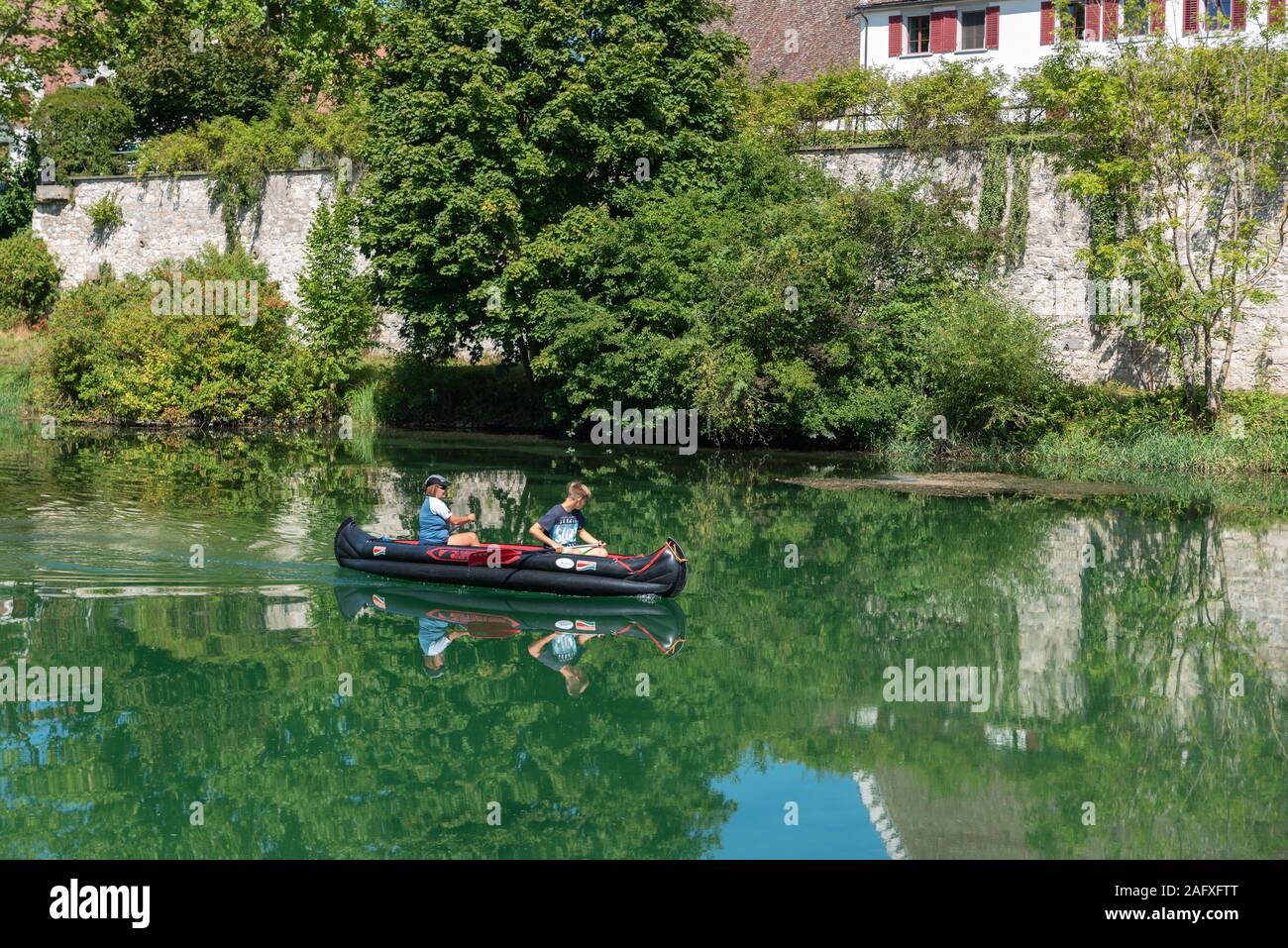 Canoeist on the Rhine by the Rheinau monastery island, Rheinau, Canton Zürich, Switzerland, Europe Stock Photo