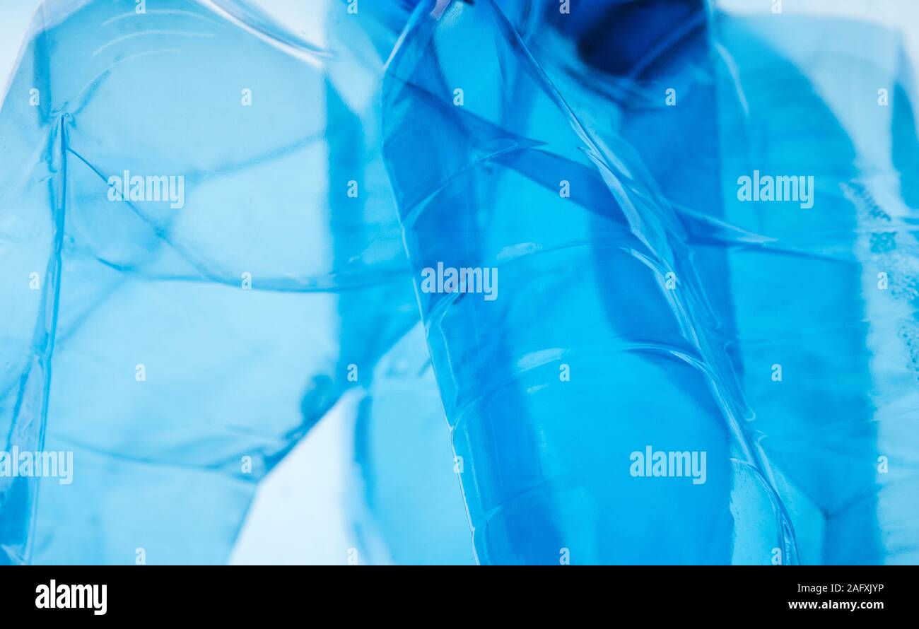 PET plastic Bottles being placed together on white Stock Photo