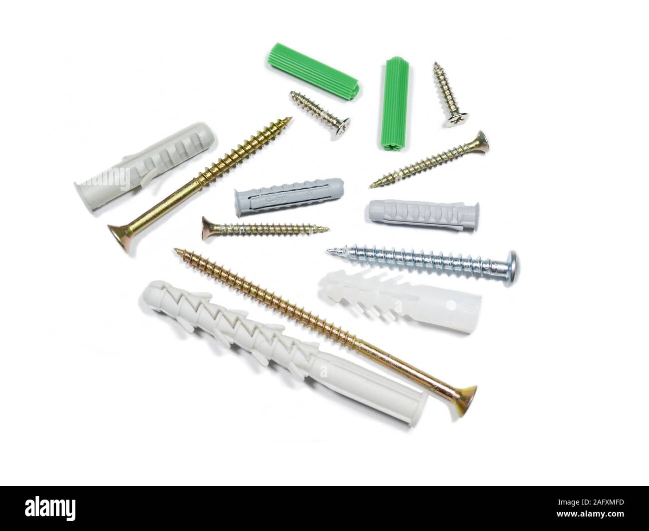 Different size and color wall plugs on white background Stock Photo Alamy