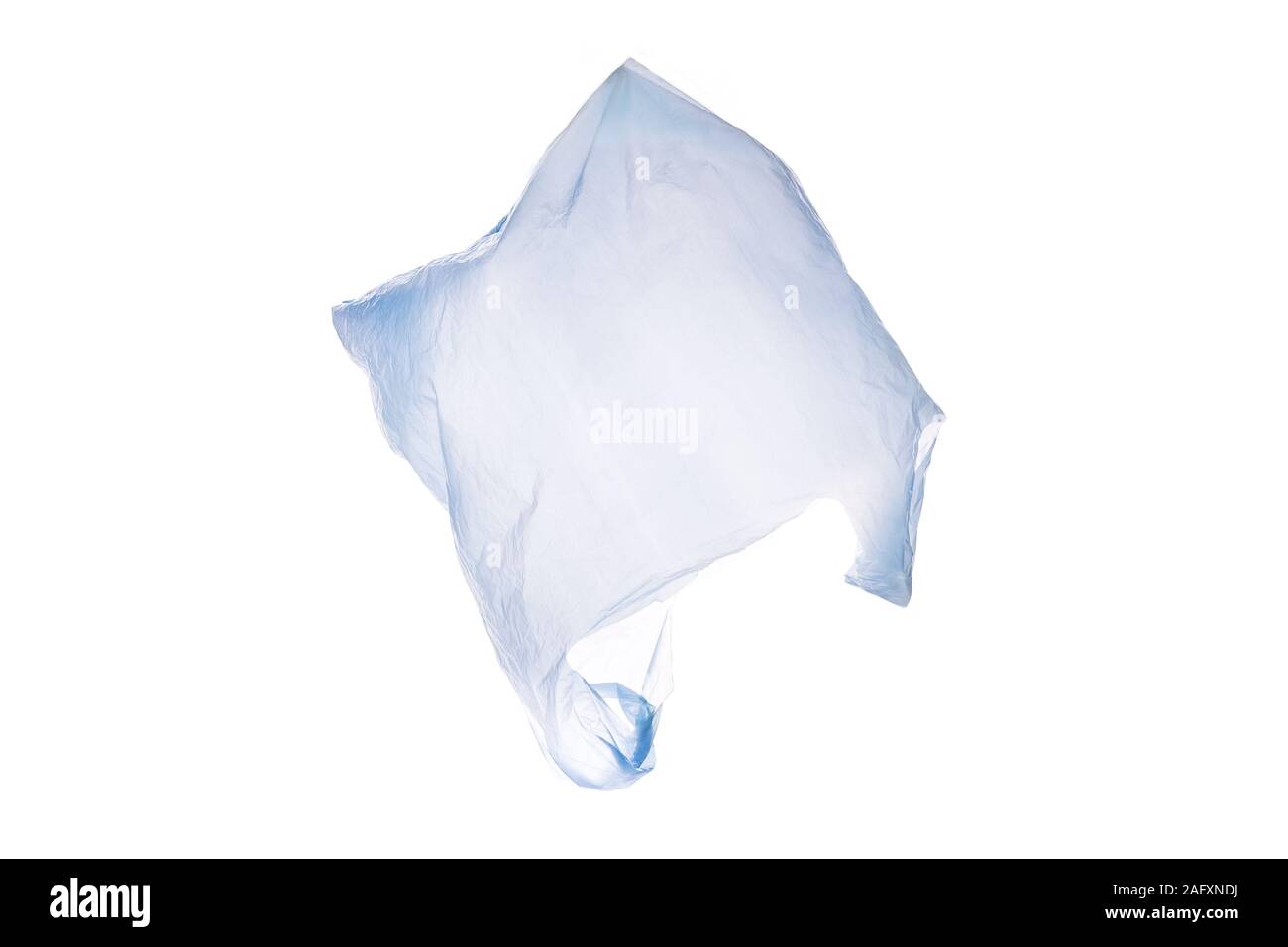 White plastic shopping bag flying over white background Stock Photo Alamy