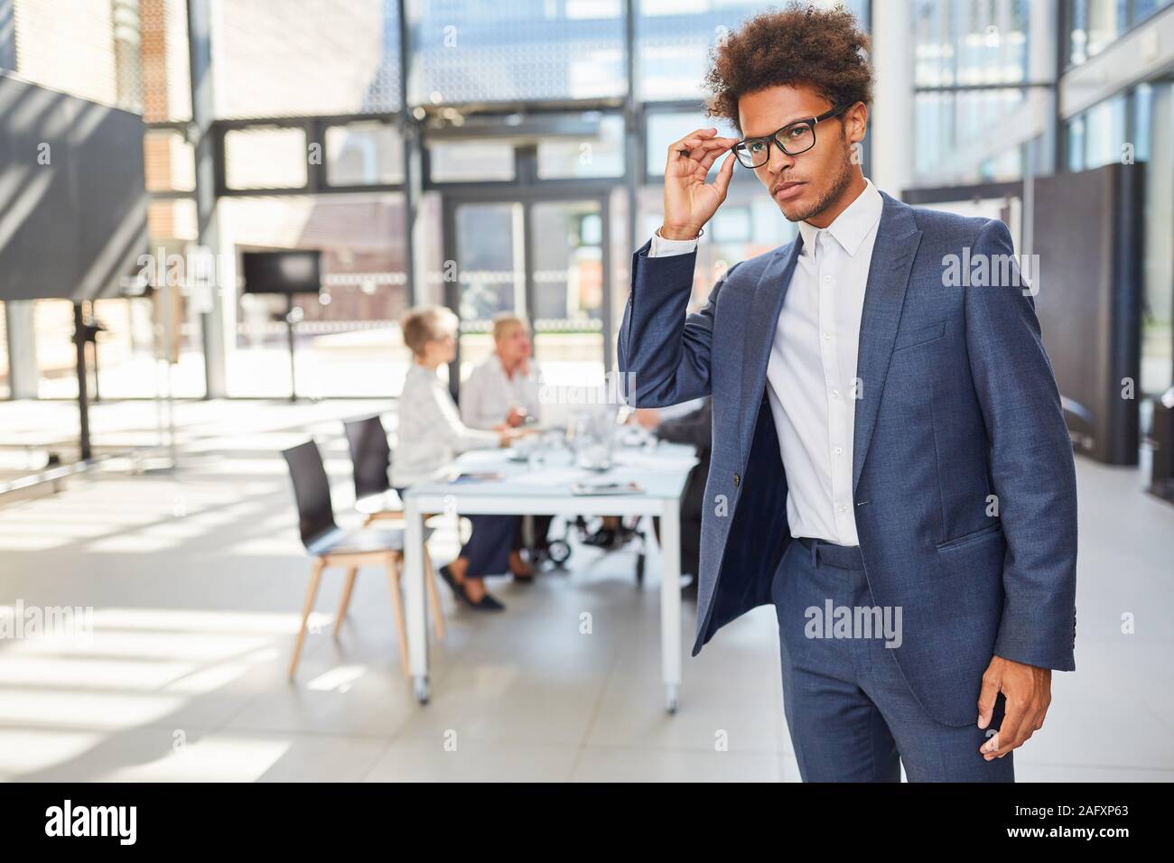 African businessman in business office as start-up founder with vision ...