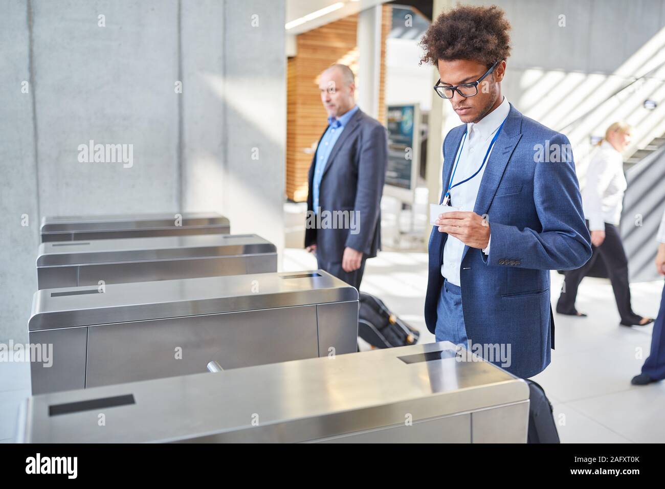 Young businessman at a security gate for access control in business Stock Photo