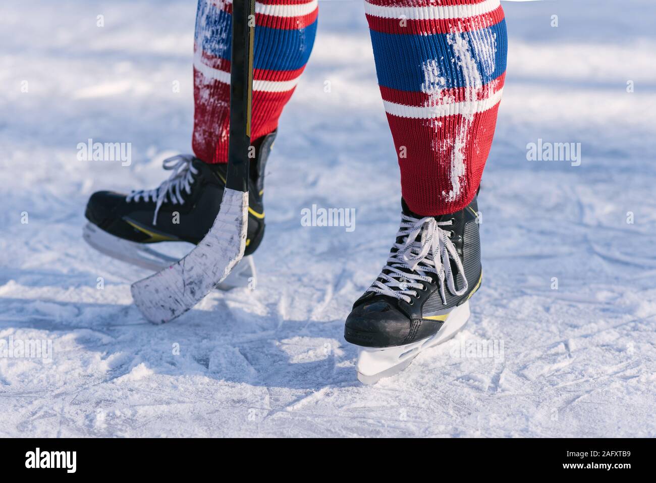 hockey players legs closeup during a game on ice Stock Photo Alamy