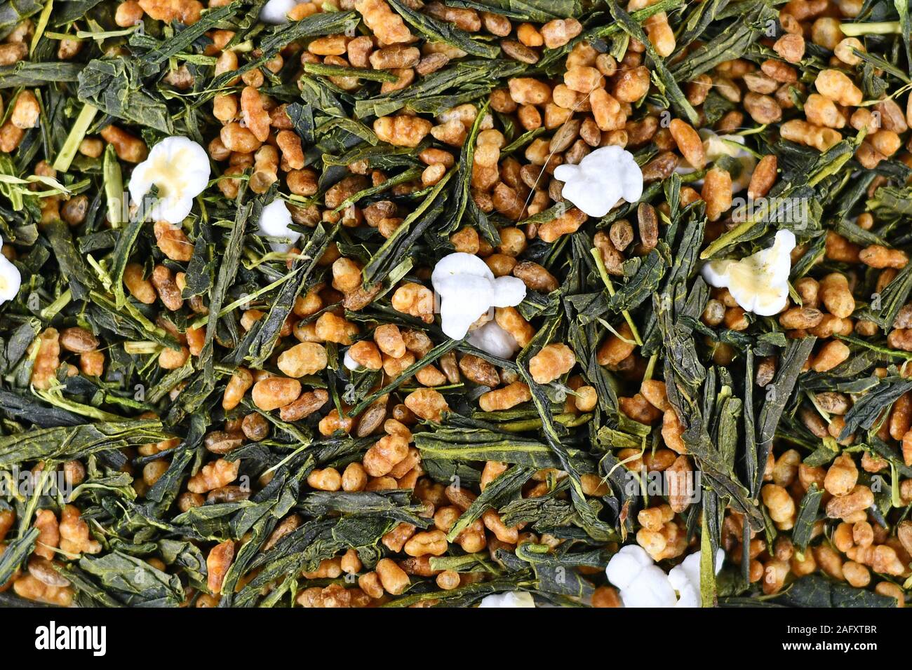 Top view of Japanese 'Genmaicha' tea, a brown rice green tea consisting of green  tea mixed with roasted popped brown rice Stock Photo - Alamy