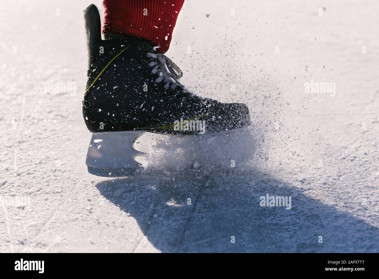 hockey players legs closeup during a game on ice Stock Photo Alamy