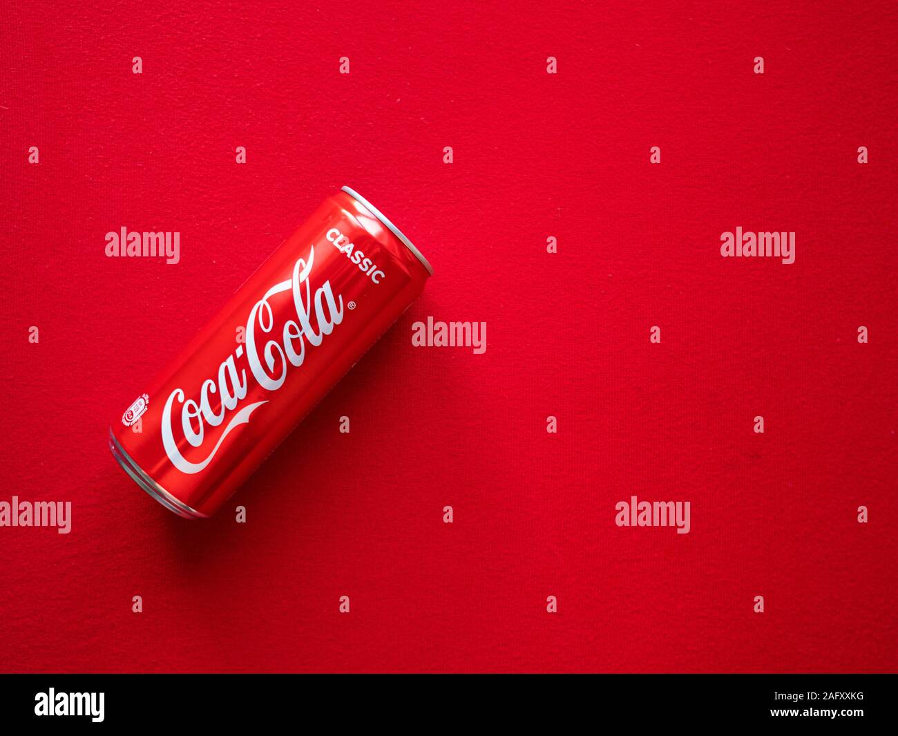 Flat lay of can of Coca Cola on a red background Stock Photo - Alamy