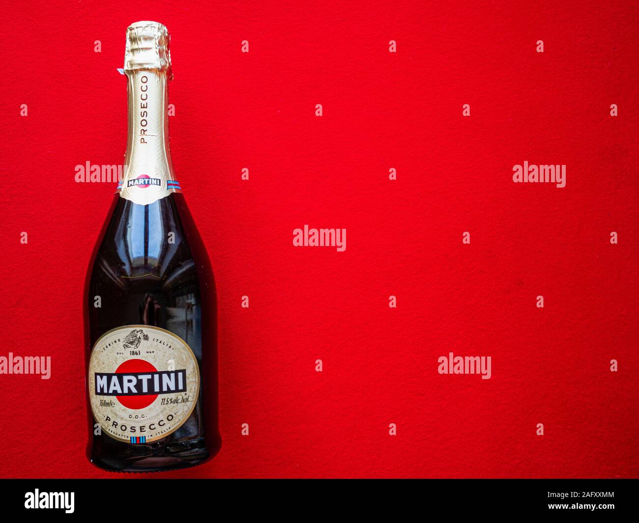 Flat lay close-up of bottle of Martinii Prosecco on a red background Stock Photo