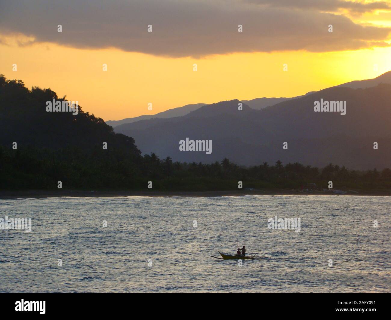 The volcanic Mindoro island, part of The Philippines archipelago, seen from the sea Stock Photo
