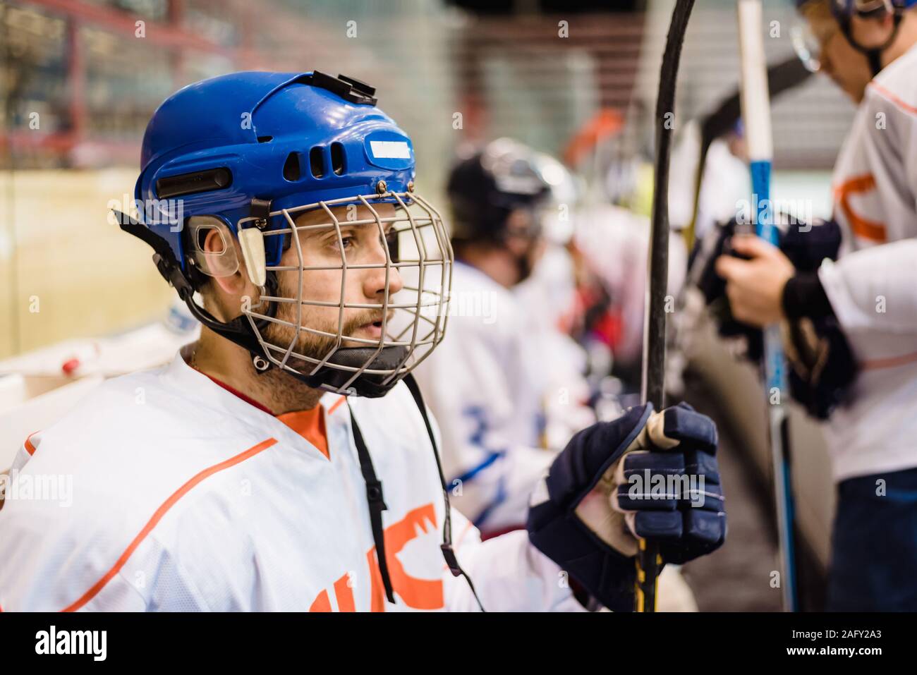 hockey players sit on the bench in the stadium Stock Photo Alamy