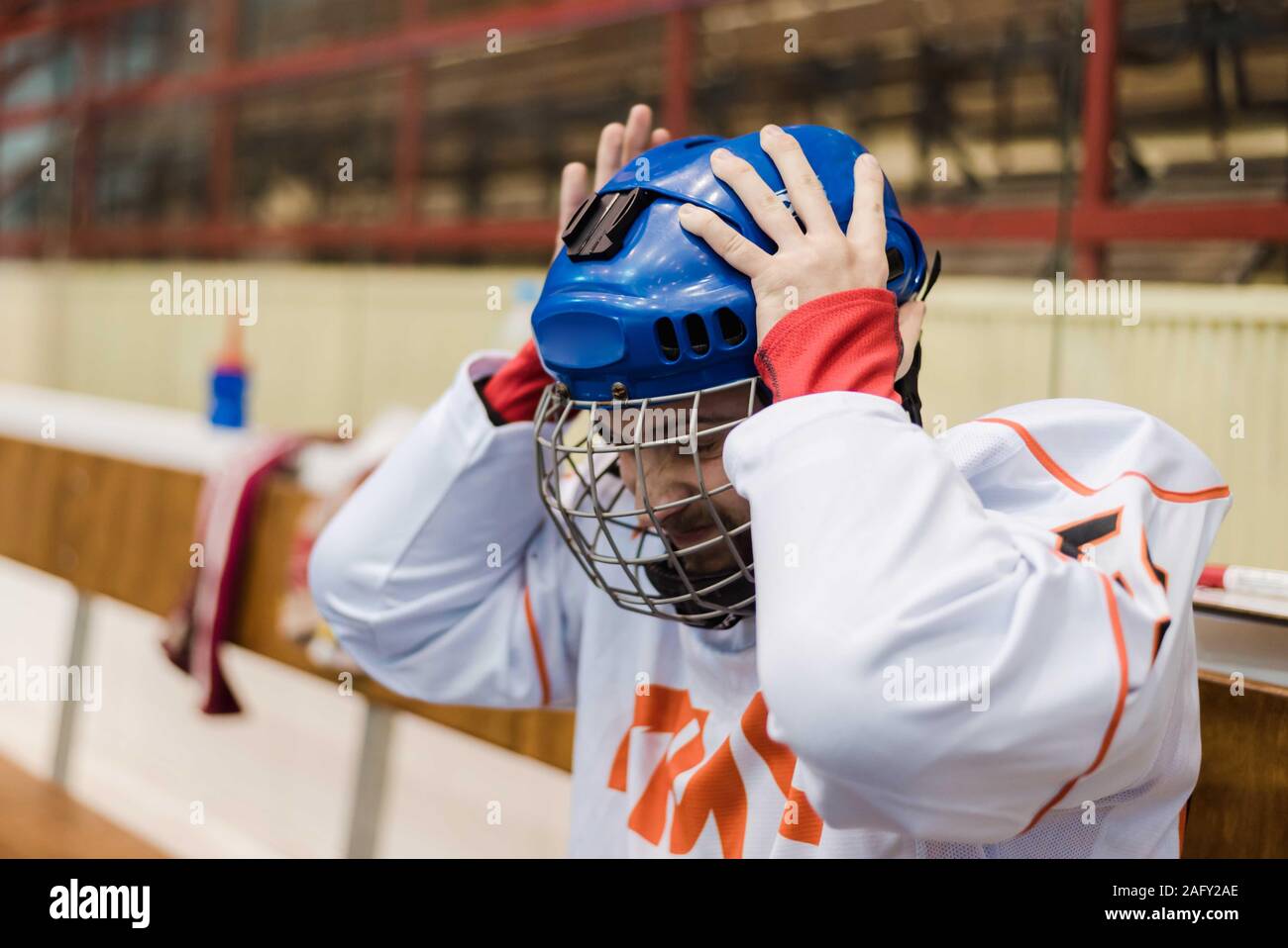 hockey players sit on the bench in the stadium Stock Photo Alamy