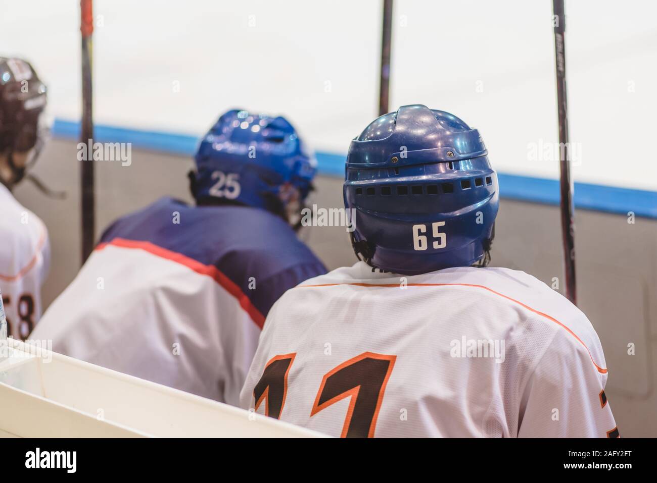 hockey players sit on the bench in the stadium Stock Photo Alamy