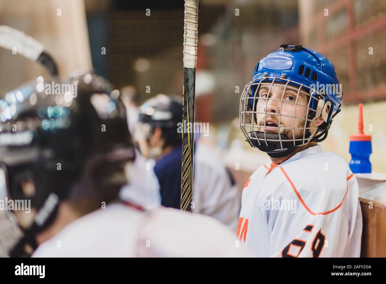 hockey players sit on the bench in the stadium Stock Photo Alamy