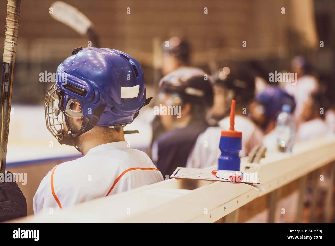 hockey players sit on the bench in the stadium Stock Photo Alamy