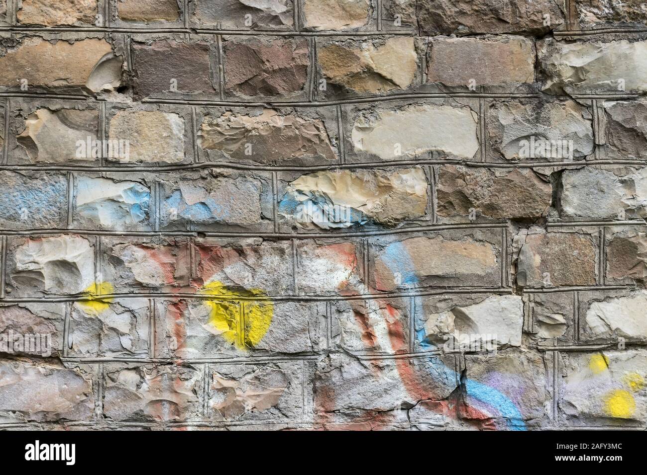 Fragment of colored graffiti painted on a brick wall. Texture. Abstract ...