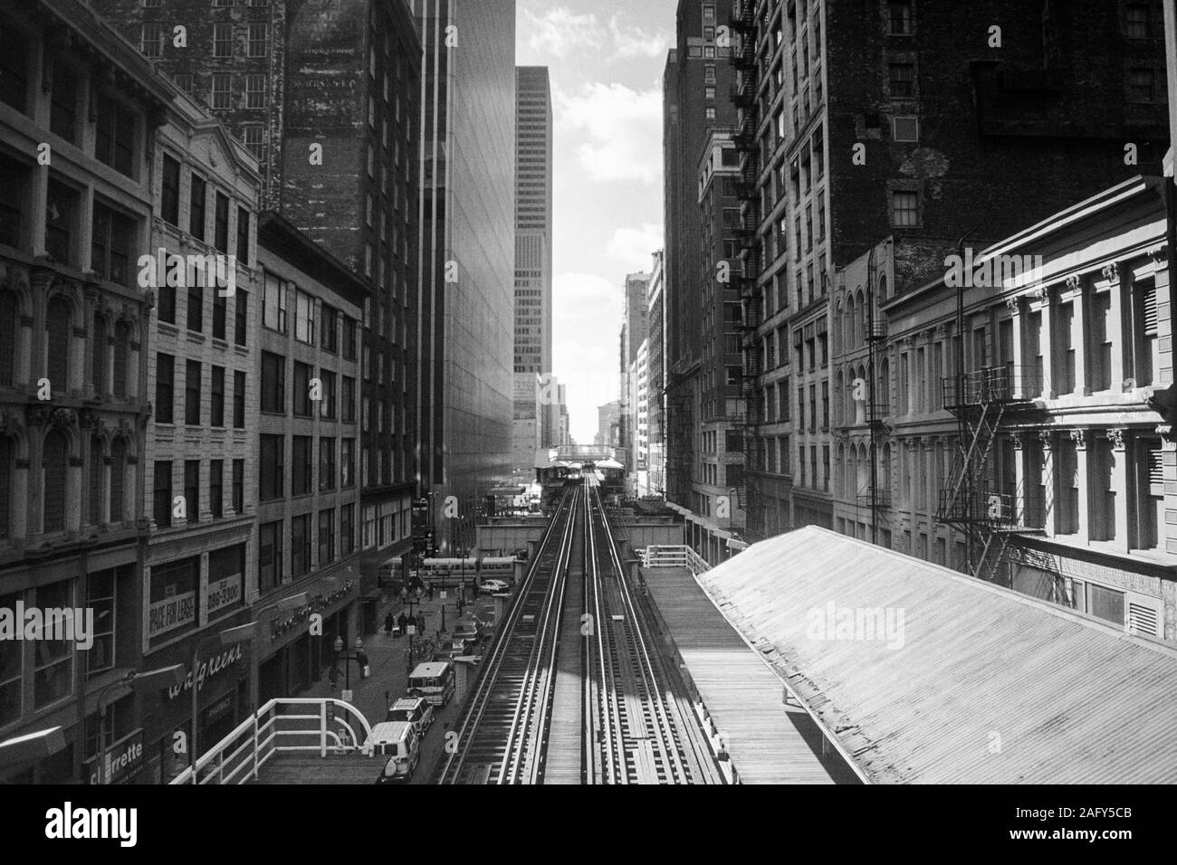 Chicago, Illinois, USA - 1996:  Archival black and white view of downtown architecture and elevated rail tracks along Wasbash Ave. Stock Photo