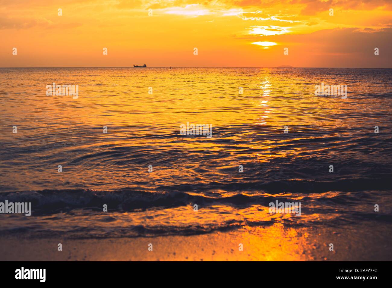 sunset sea beach dusk orange sky in summer season. Stock Photo