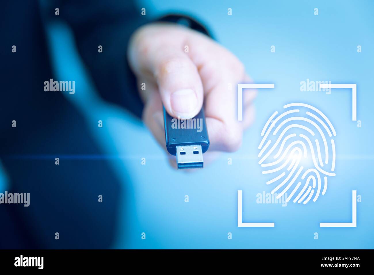 USB Key Lock Access with Fingerprint Biometrics Scanner for future data security technology concept. Stock Photo