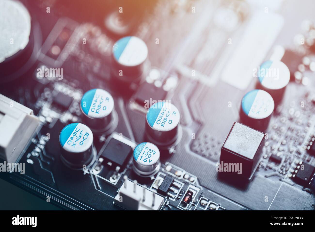 Solid capacitor on printed circuit board on computer mother board. Stock Photo