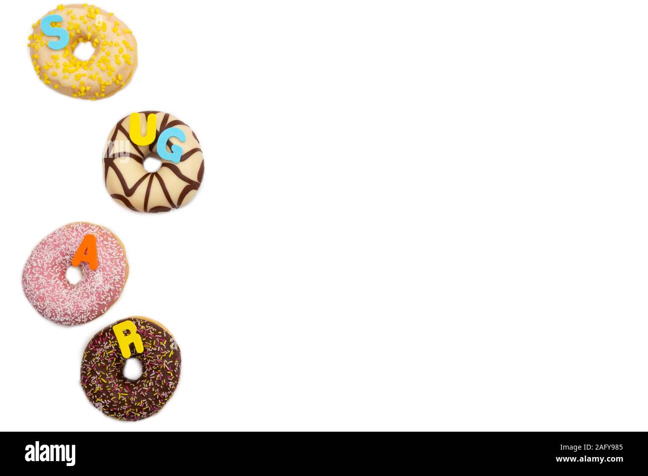 various colored delicious donuts on white background with the word sugar, space for text Stock Photo