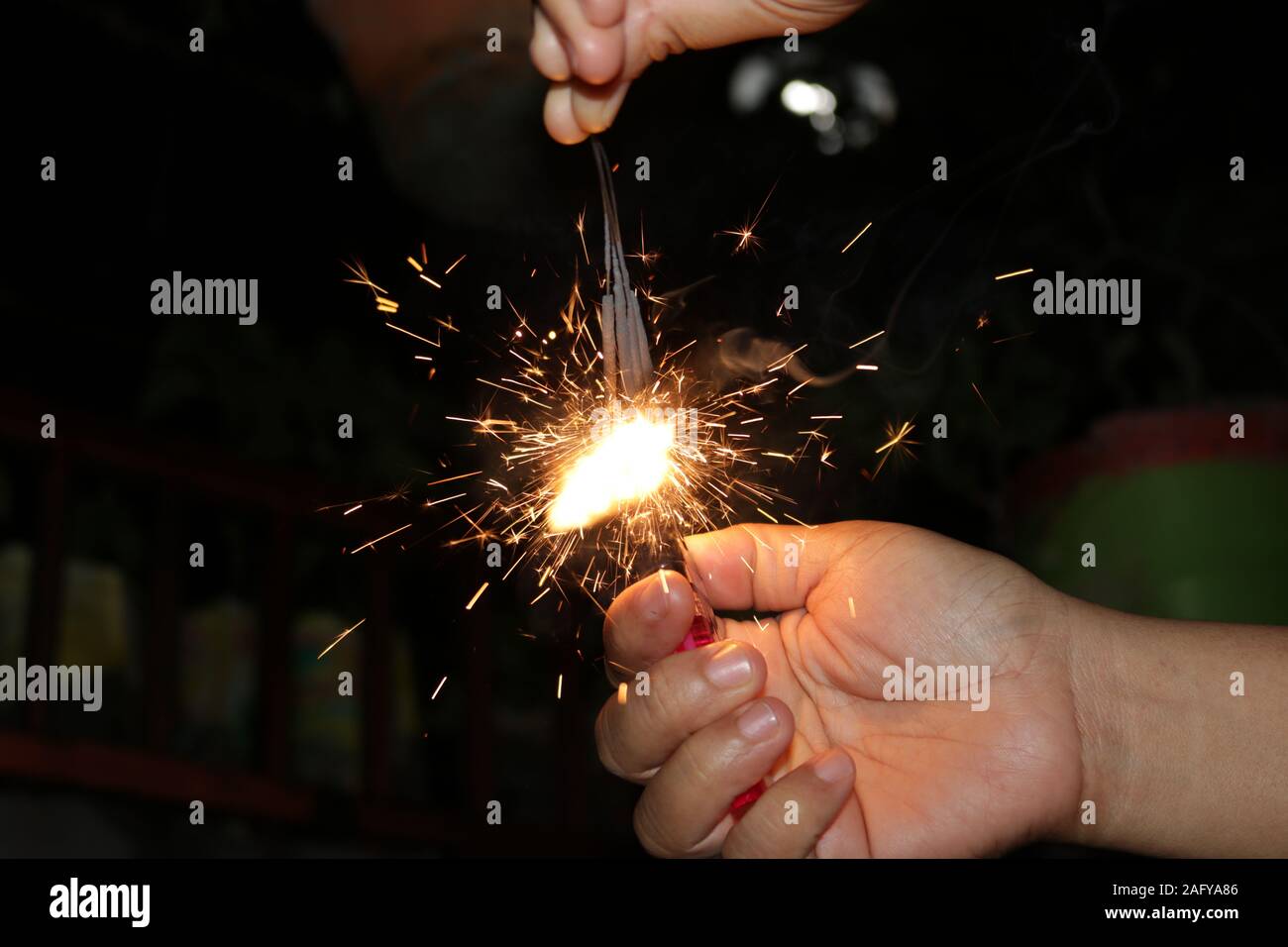 Small fireworks are lit at the new year's event Stock Photo Alamy