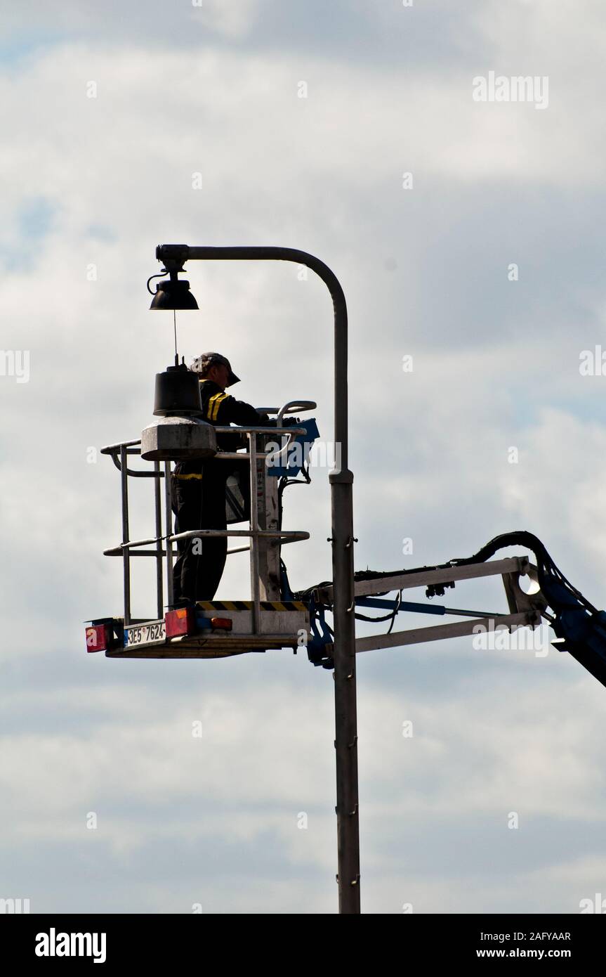 street maintenance worker repairing a street lamp Stock Photo Alamy